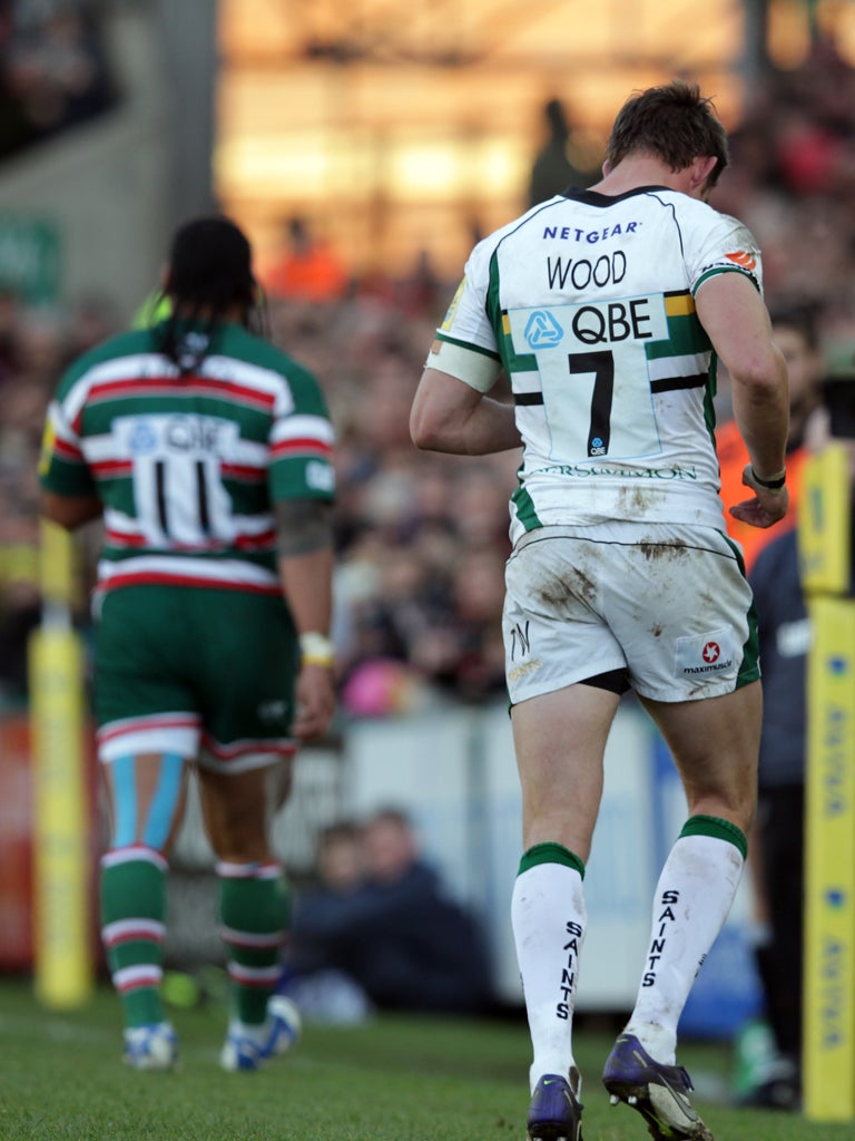 Alesana Tuilagi and Tom Wood leave the field at Leicester