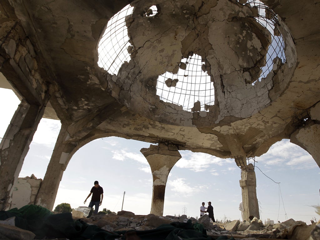 Sirte's cemetery is typical of the destruction wrought by rebels on the city. Fighters from Misrata, which had been punished by the dictator's forces months earlier, fired indiscriminately
