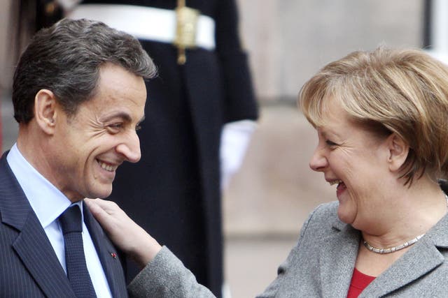 France's Nicolas Sarkozy and Germany's Angela Merkel are trying to stand united