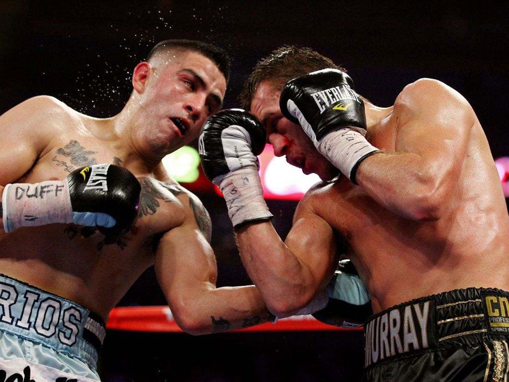 Brandon Rios (left) connects with a left hand against John Murray