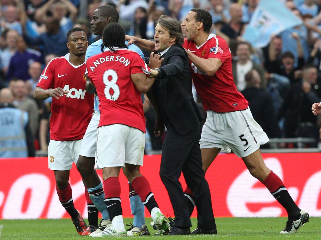 Rio Ferdinand was involved in a heated exchange with Mario Balotelli when United were dumped out at the semi-final stage last season
