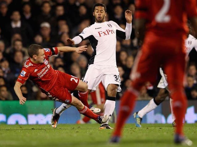Jay Spearing makes the tackle on Fulham’s Moussa Dembélé for which he received a red card at Craven Cottage last night