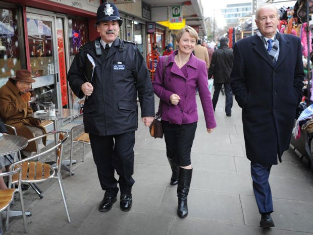 Lord Stevens (right), shadow home secretary Yvette Cooper and Sergeant Ian Rowing walk along Church Street market in north west London, after they launched the Independent Commission on the Future of Policing