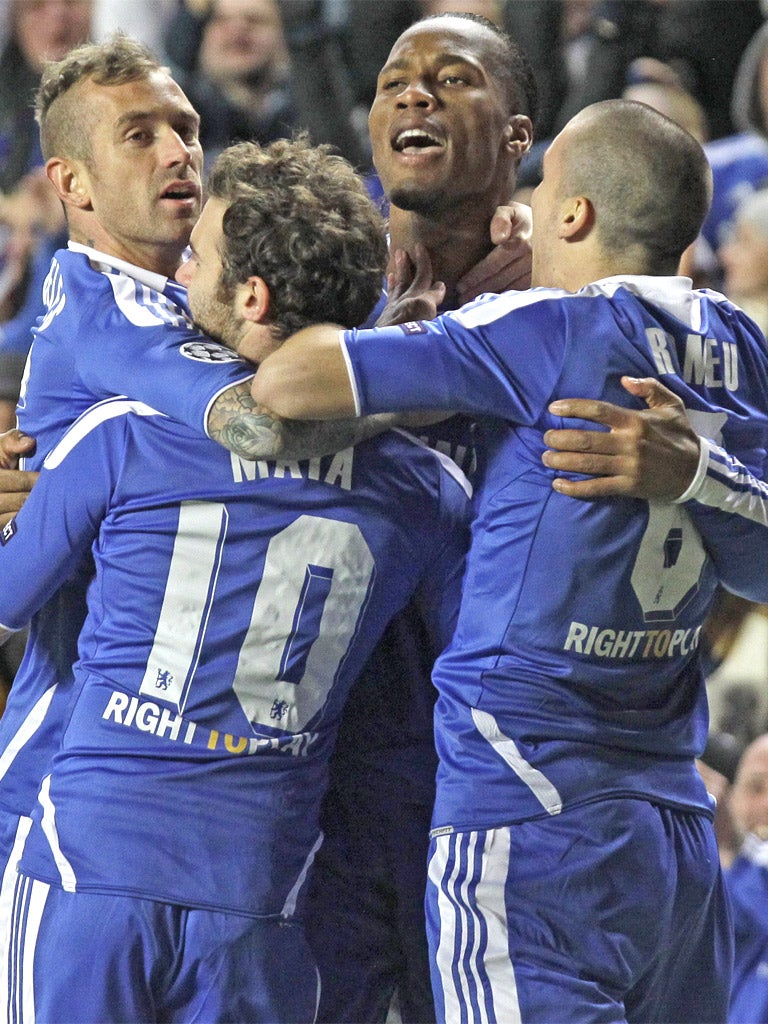 The Chelsea players congratulate two-goal hero Didier Drogba