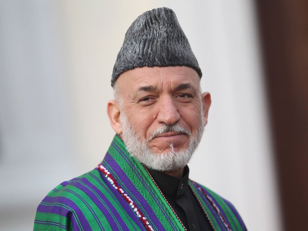 Afghan President Hamid Karzai cut short a European trip and returned to Kabul today
