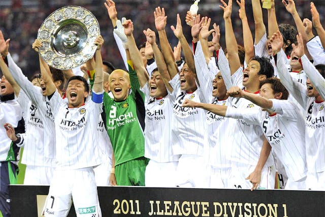 Jubilant Kashiwa Reysol players celebrate winning their first J-League title last weekend