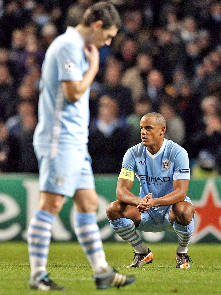 Manchester City's Gareth Barry and Vincent Kompany reflect on an early exit from the Champions League