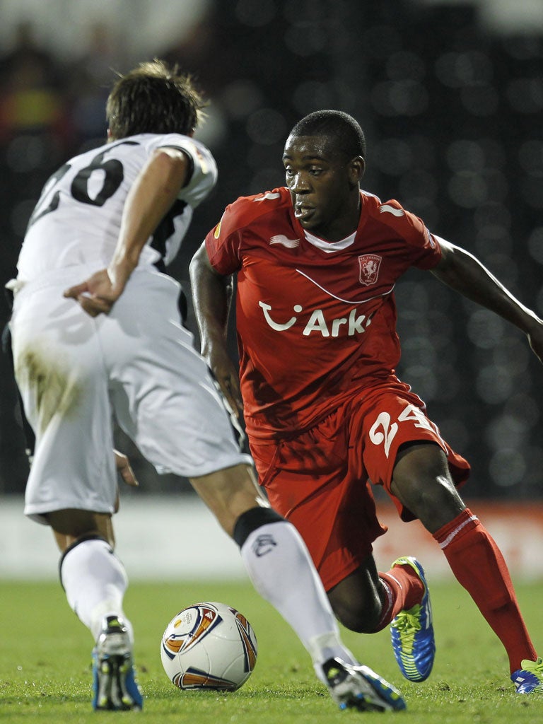 FC Twente's Ola John (right) vies for the ball with Fulham's Zdenek Grygera in a Europa League group game