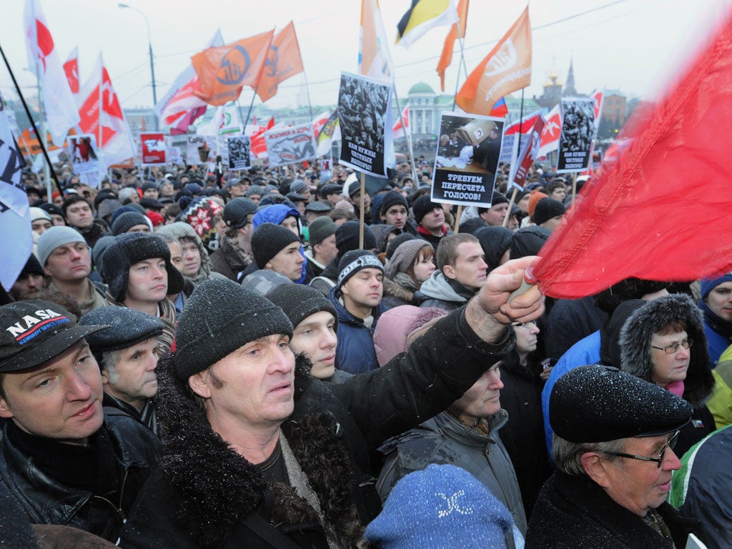 People shout during an authorized opposition protest in Moscow against the alleging mass fraud in the parliamentary polls