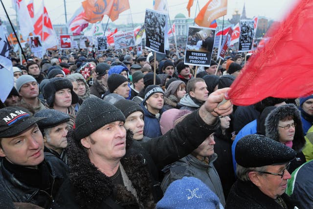 People shout during an authorized opposition protest in Moscow against the alleging mass fraud in the parliamentary polls