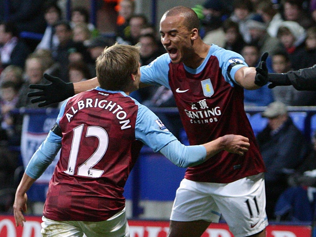 Gabby Agbonlahor (right) rushes to embrace Aston Villa's opening goalscorer, Marc Albrighton