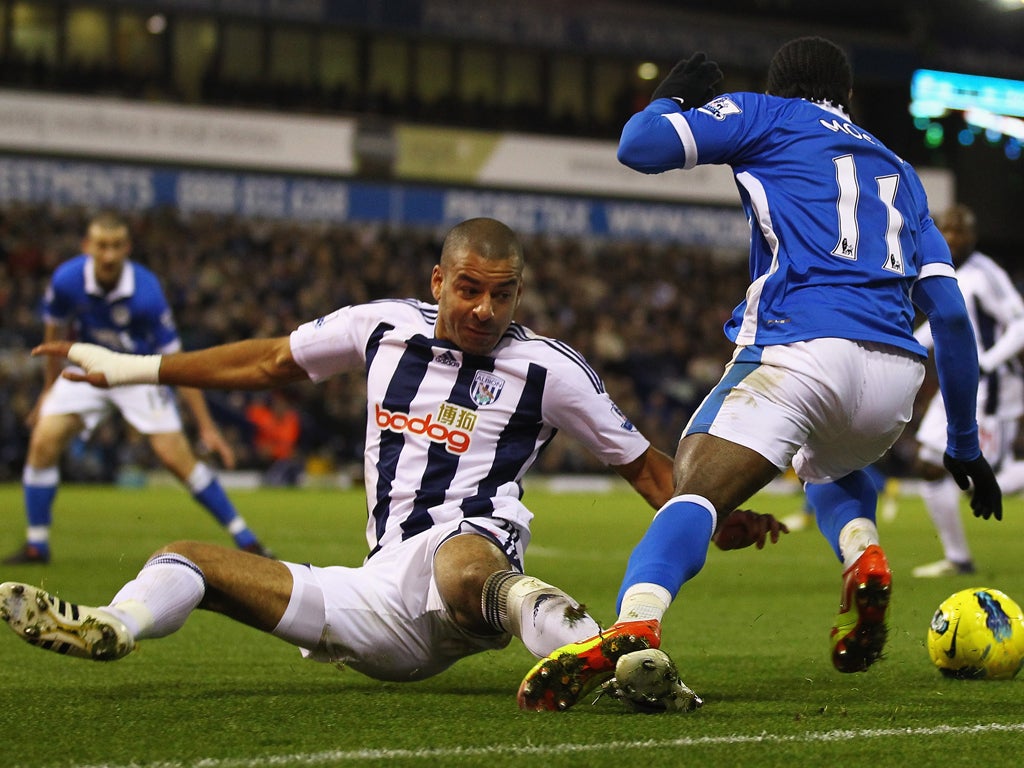 Man of the match Victor Moses (right) is fouled by Steven Reid in the penalty area, which led to Jordi Gomez's winner for Wigan