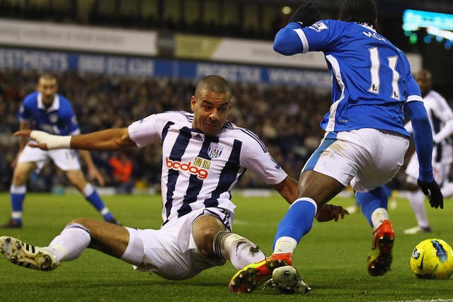 Man of the match Victor Moses (right) is fouled by Steven Reid in the penalty area, which led to Jordi Gomez's winner for Wigan