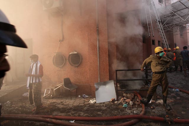 Firefighters at the scene of the hospital blaze in Calcutta yesterday