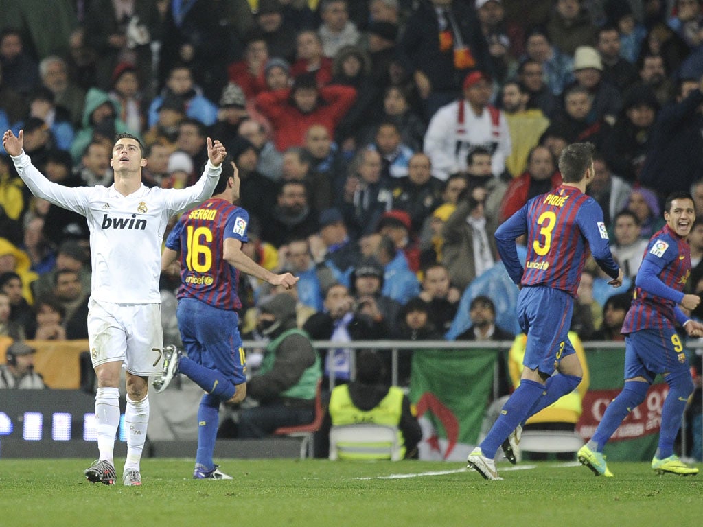 Contrasting emotions for Cristiano Ronaldo (left) and the Barcelona players