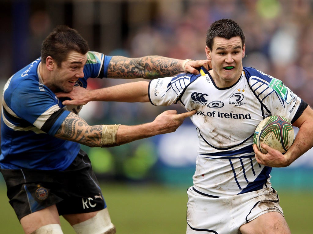 Leinster’s Jonathan Sexton hands off Bath’s Ryan Caldwell
