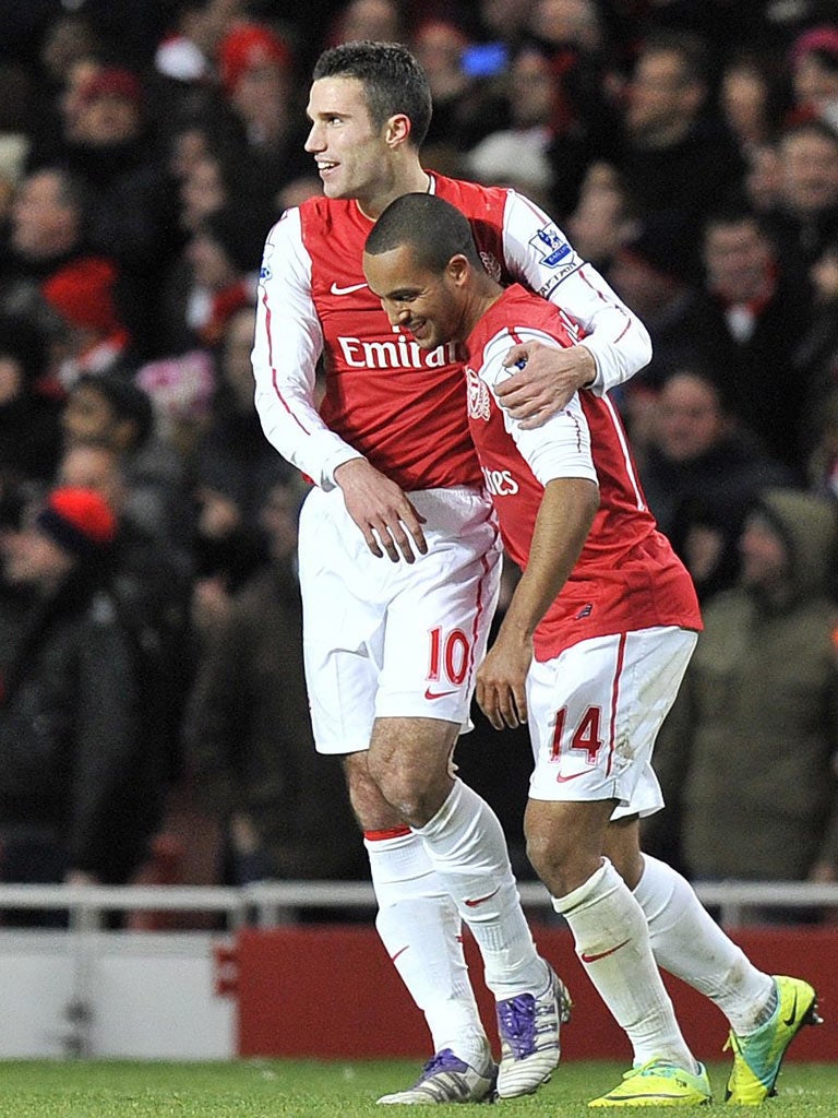 Robin van Persie is congratulated by Theo Walcott (right) after his spectacular goal for Arsenal