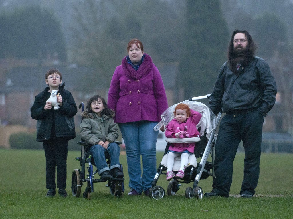 Caring full-time: Chris and Emma Ford and their children (from left) Martyn, seven, Rhys, six, and three -year-old Caitlin