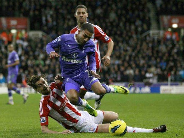 Jonathan Woodgate tackles Tottenham’s Aaron Lennon during
Stoke’s win on Sunday