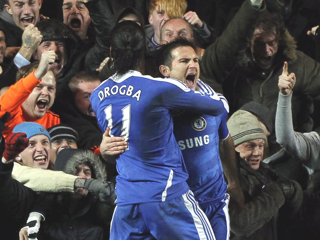 Frank Lampard is embraced by Didier Drogba after smashing in the winner