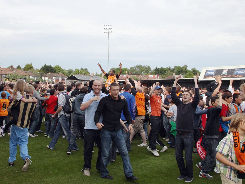 Barnet fans celebrate at Underhill after their team's victory ensured their league survival at the end of last season