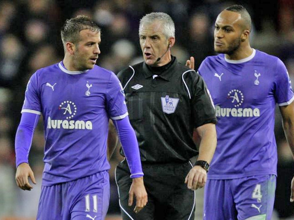Spurs’ Rafael van der Vaart and Younes Kaboul who was shown two yellows at Stoke by referee Chris Foy