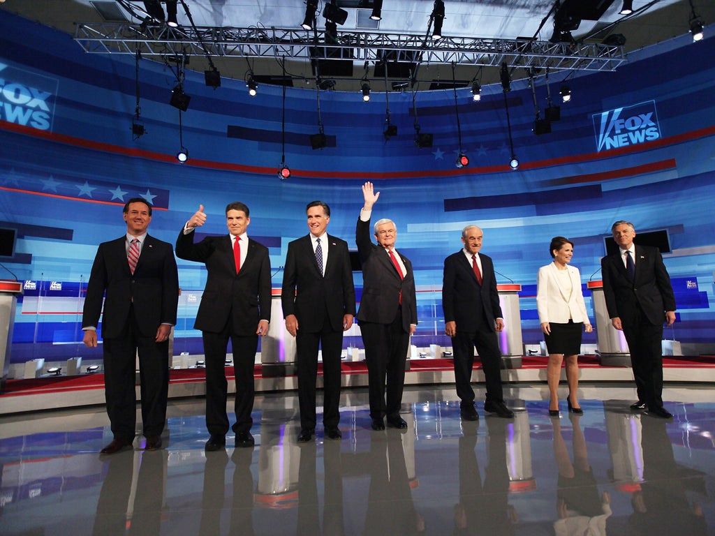 The Republican candidates Rick Santorum, Rick Perry, Mitt Romney, Newt Gingrich, Ron Paul, Michele Bachmann and Jon Huntsman Jnr before Thursday's televised debate in Sioux City