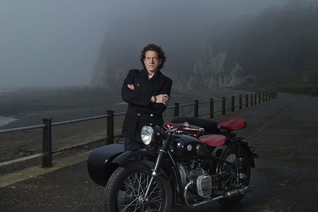 <p>Stephen Webster, photographed on the Kent coast, with his beloved motorcycle and sidecar</p>