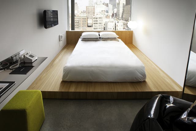 <p>Clean and serene: Platform beds</p><p>were inspired by Japanese ryokans, while</p><p>iPads add a hi-tech touch</p>