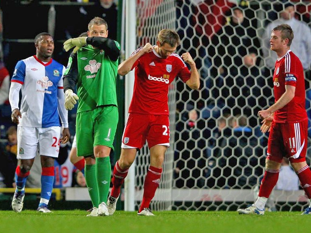 Rovers and out: Blackburn keeper Paul Robinson looks dejected at the final whistle as Gareth McAuley celebrates