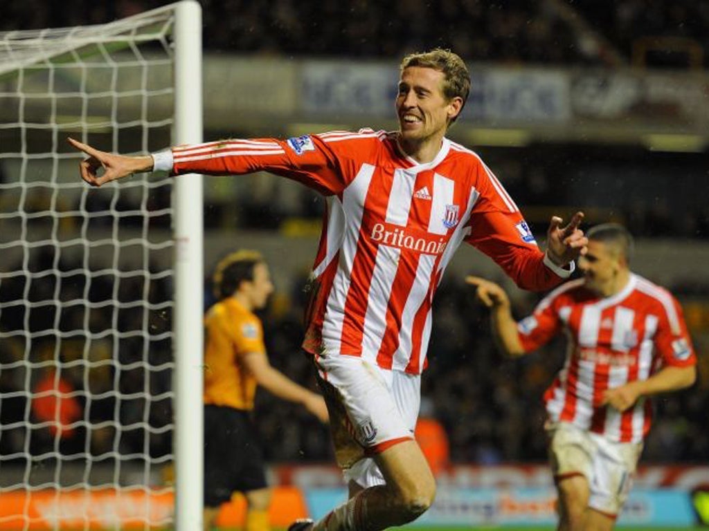 Peter Crouch makes his point after scoring the winner at Wolves