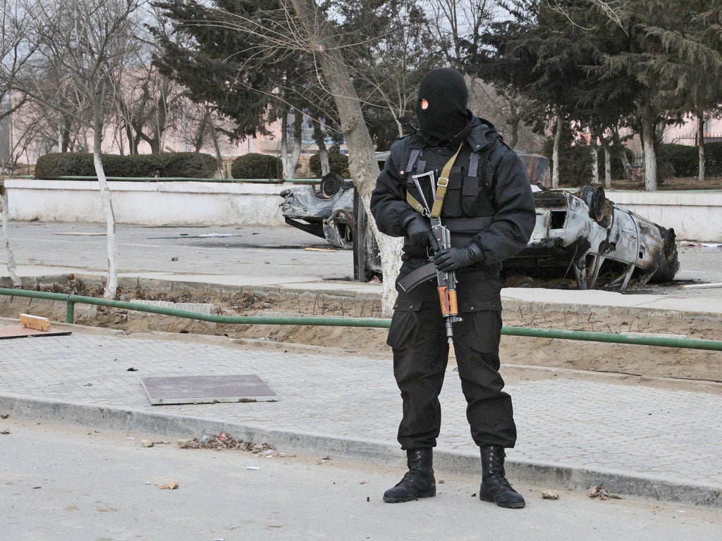 A riot police officer on patrol in Zhanaozen after violent clashes over the weekend