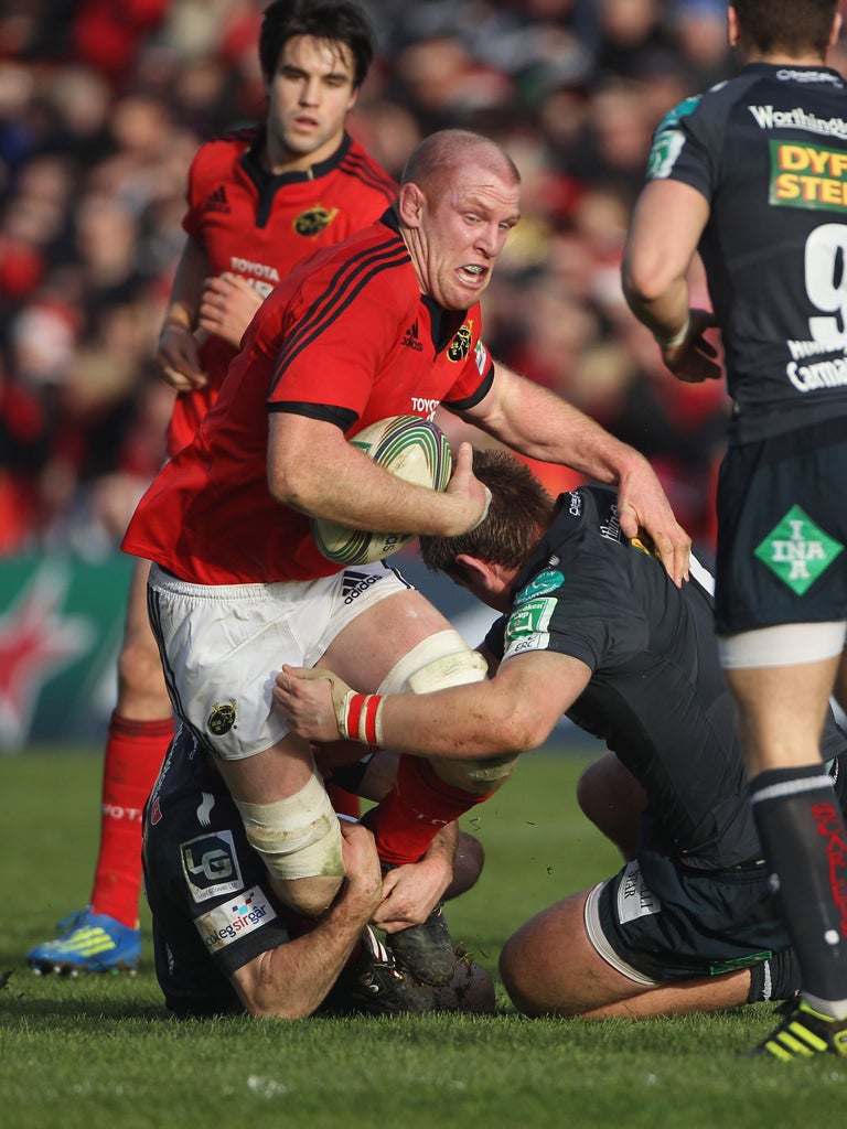 Munster's Paul O'Connell finds his way blocked by the Scarlets