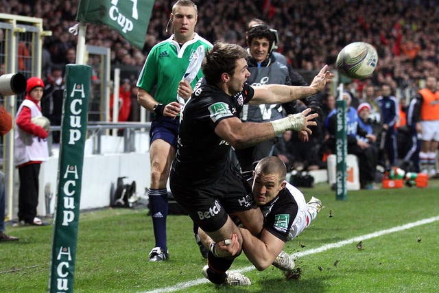 <p>Mike Brown of Harlequins makes a try-saving tackle on Toulouse wing Vincent Clerc</p>
