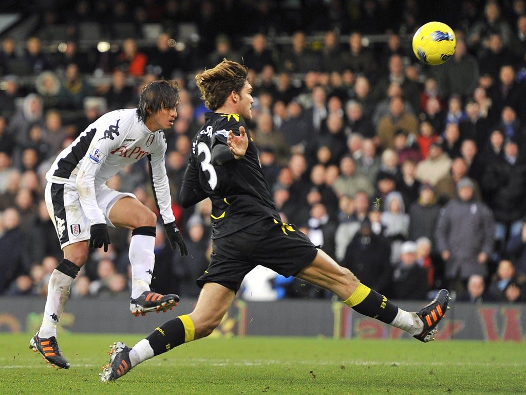 Bolton's Marcos Alonso fails to stop Fulham's Bryan Ruiz (left) from scoring