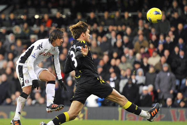 <p>Bolton's Marcos Alonso fails to stop Fulham's Bryan Ruiz (left) from scoring</p>