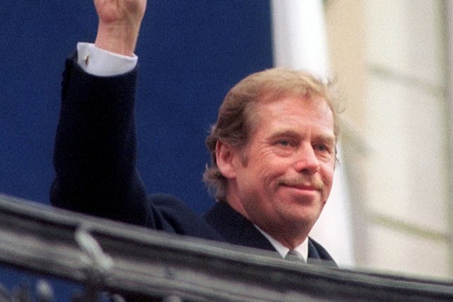 Victory: Havel salutes the crowd at Prague Castle following his election as the last president of Czechoslovakia in December 1989
