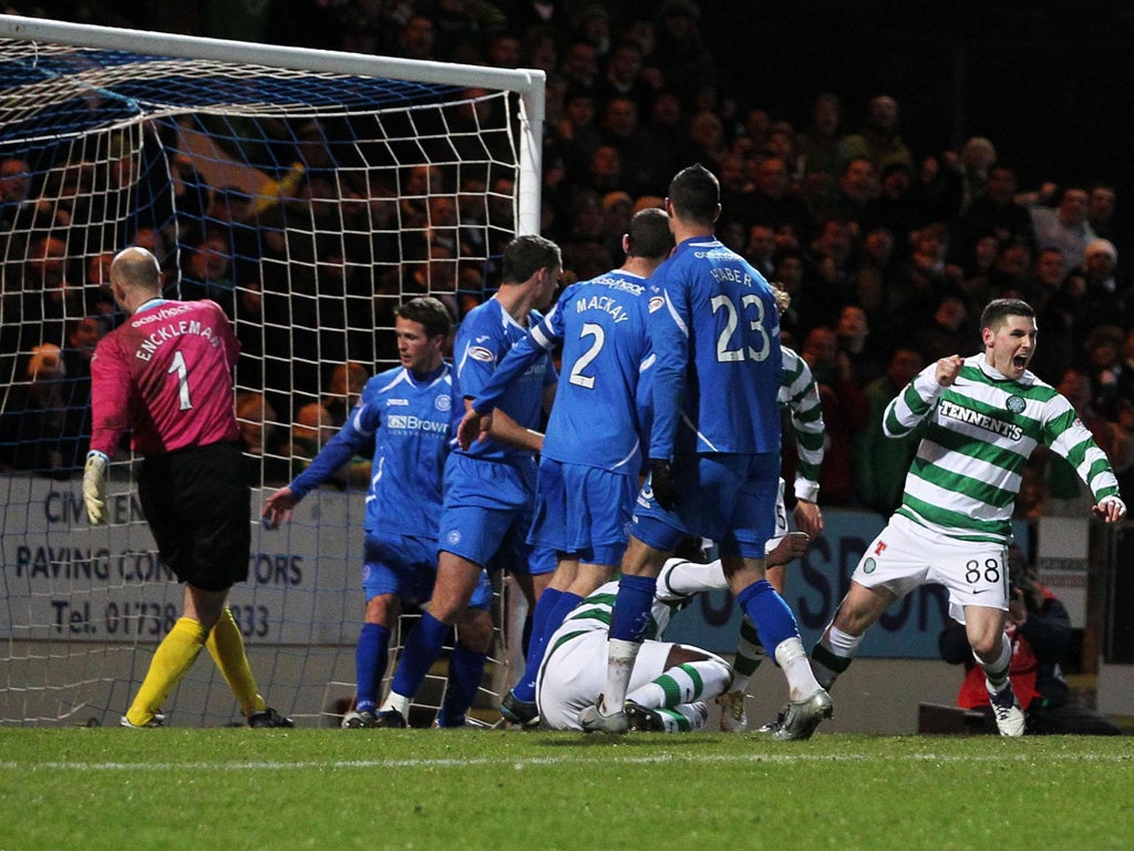 <p>Celtic's Gary Hooper (right) turns away after scoring the opener</p>