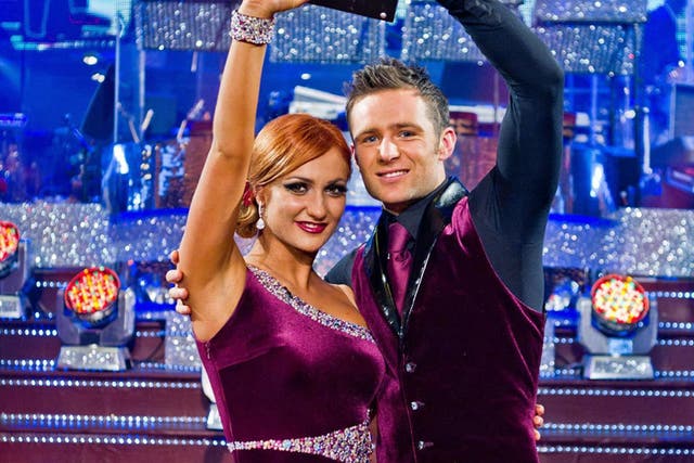 <p>Aliona Vilani and Harry Judd celebrate with the winning trophy on Strictly Come Dancing,after their performances impressed viewers</p>