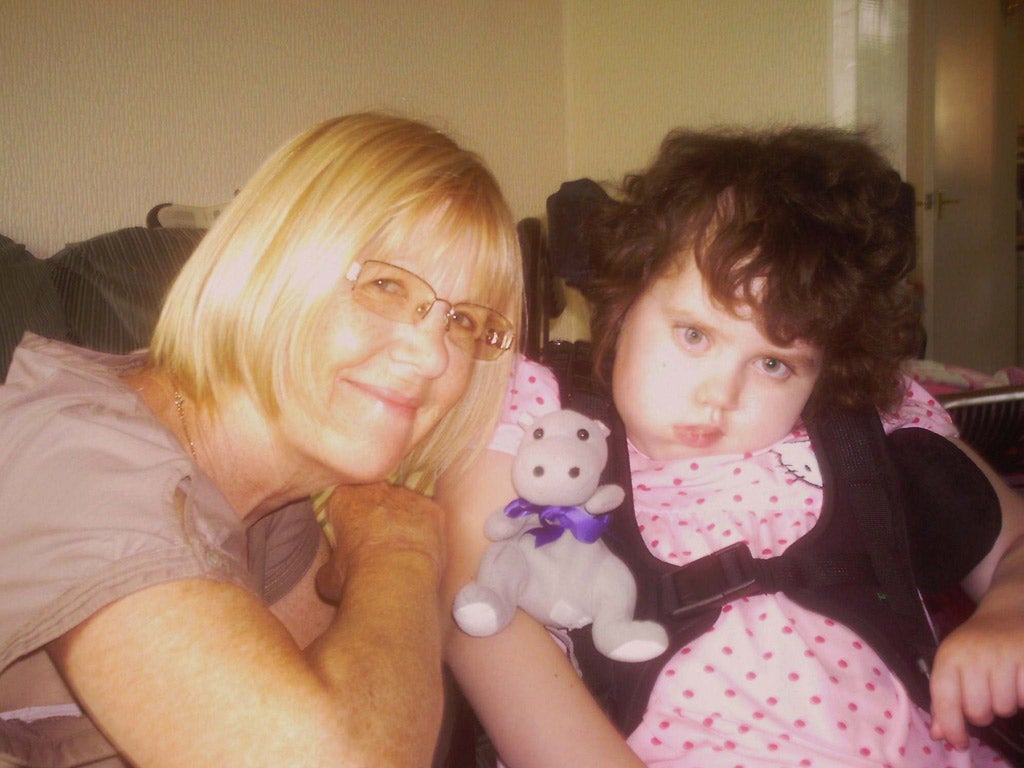 Shona with Rainbow Trust support worker Val and her favourite toy, Hippo