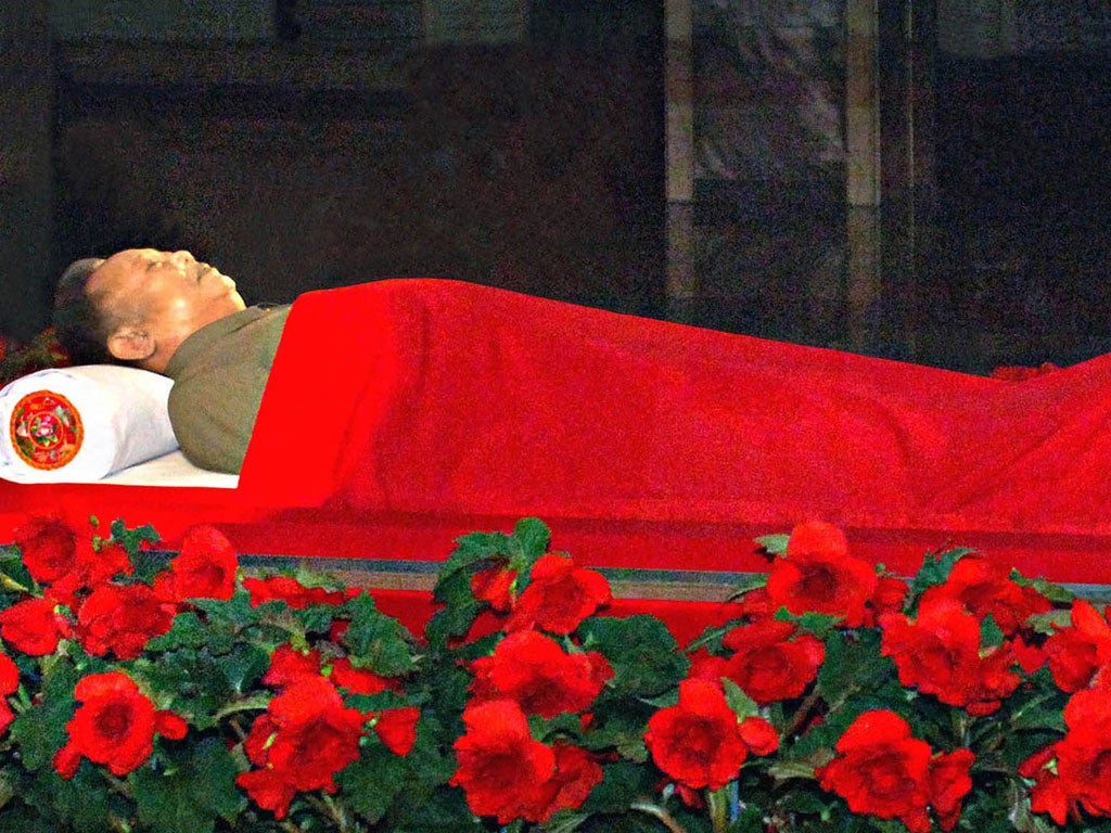 Kim Jong-il lies in state in a glass coffin in Pyongyang yesterday