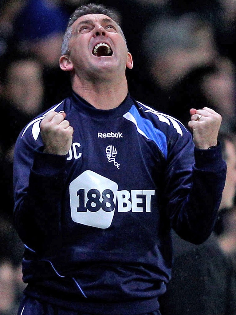 <p>Owen Coyle shows his delight as Bolton's second goal goes in</p>