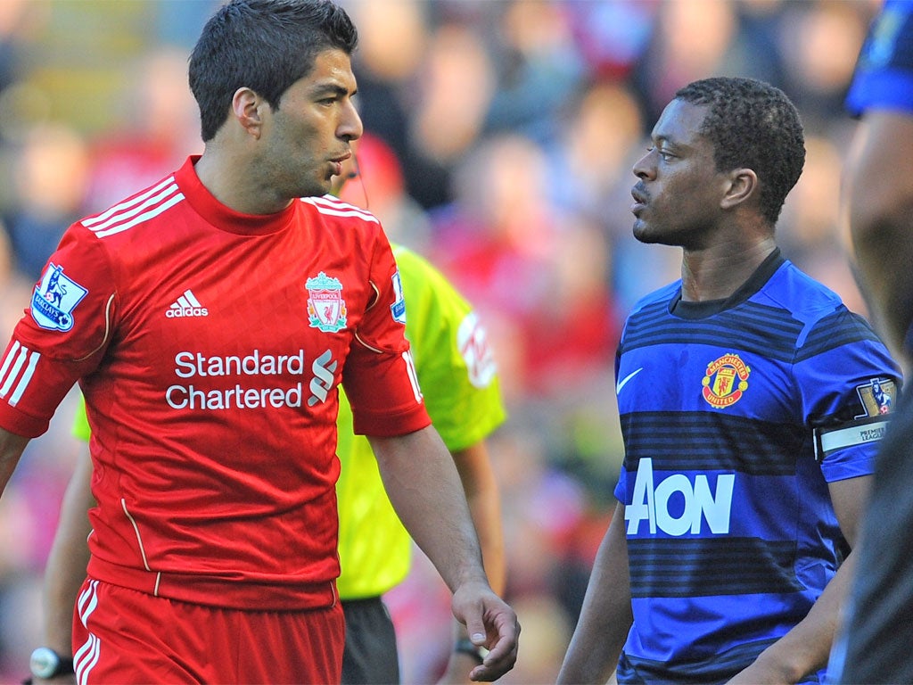 Suarez and Evra during the October fixture
