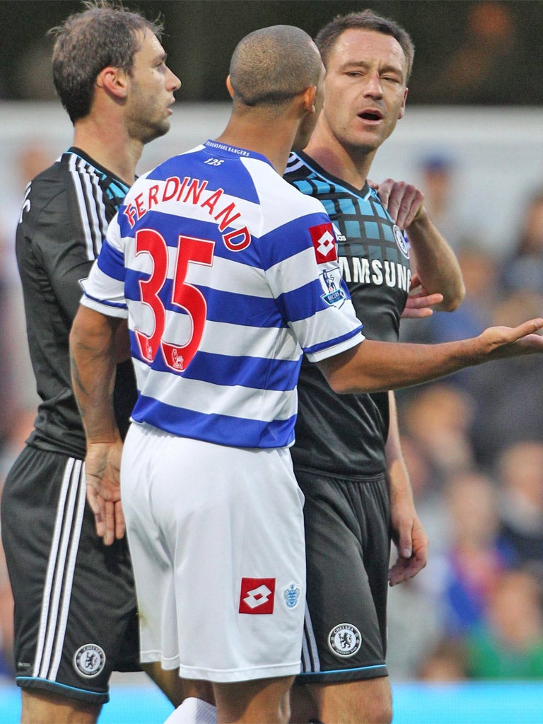 The Chelsea captain, John Terry, clashes with QPR's Anton Ferdinand during the match at Loftus Road
