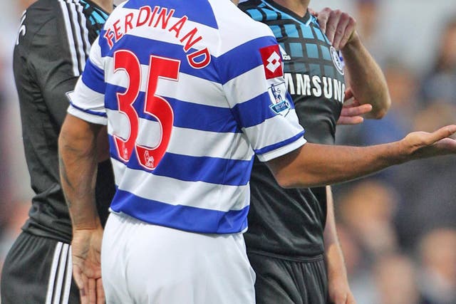 The Chelsea captain, John Terry, clashes with QPR's Anton Ferdinand during the match at Loftus Road