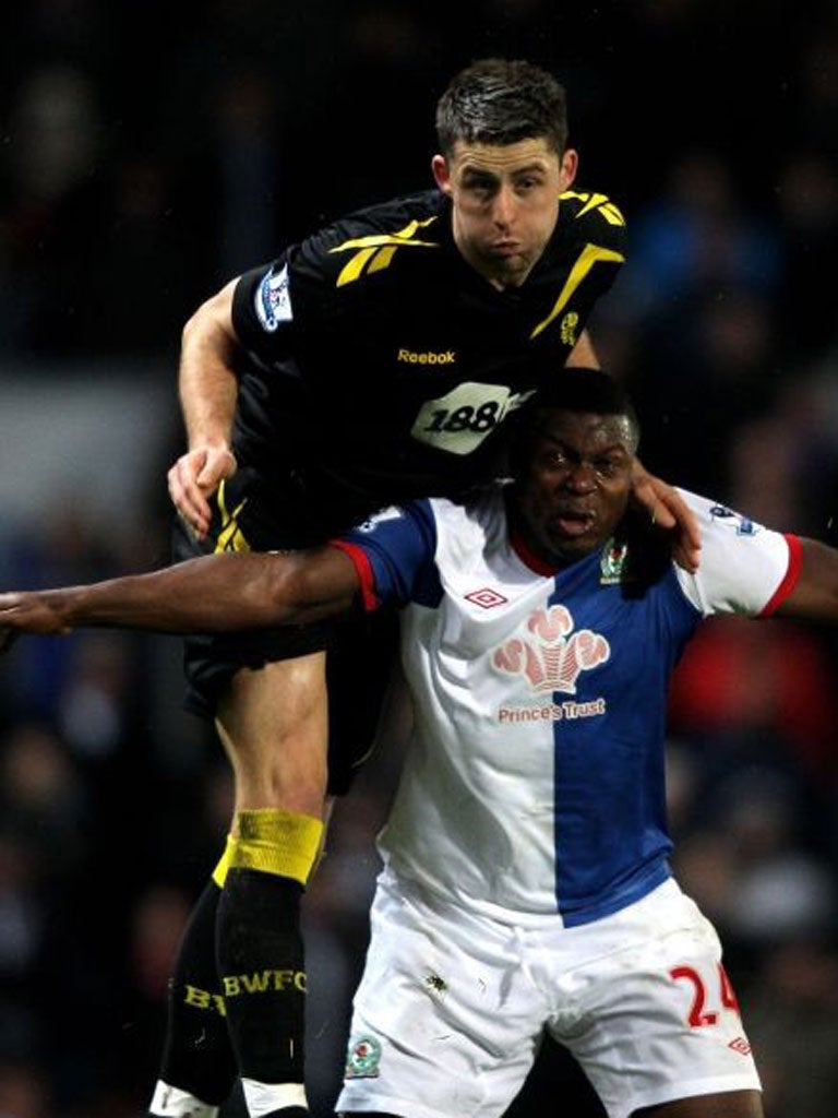 Bolton Wanderers' Gary Cahill outjumps Blackburn striker Yakubu