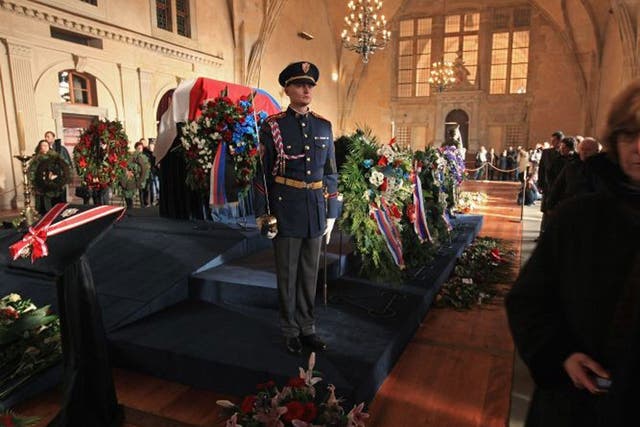 Members of the honour guard stand by Havel's coffin in Prague Castle