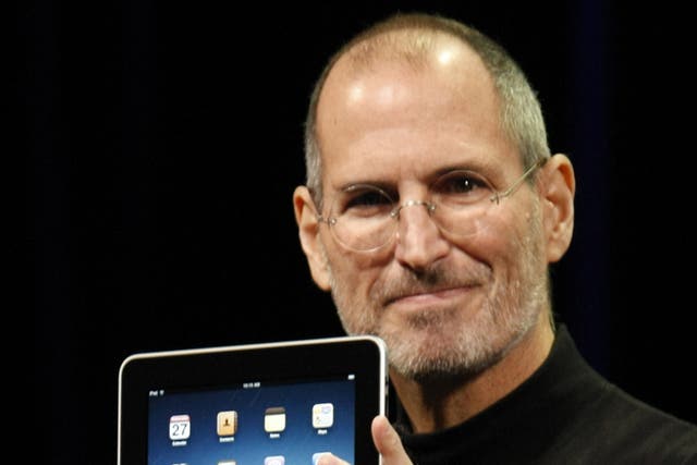 Game-changer: The late Apple boss Steve Jobs with the iPad