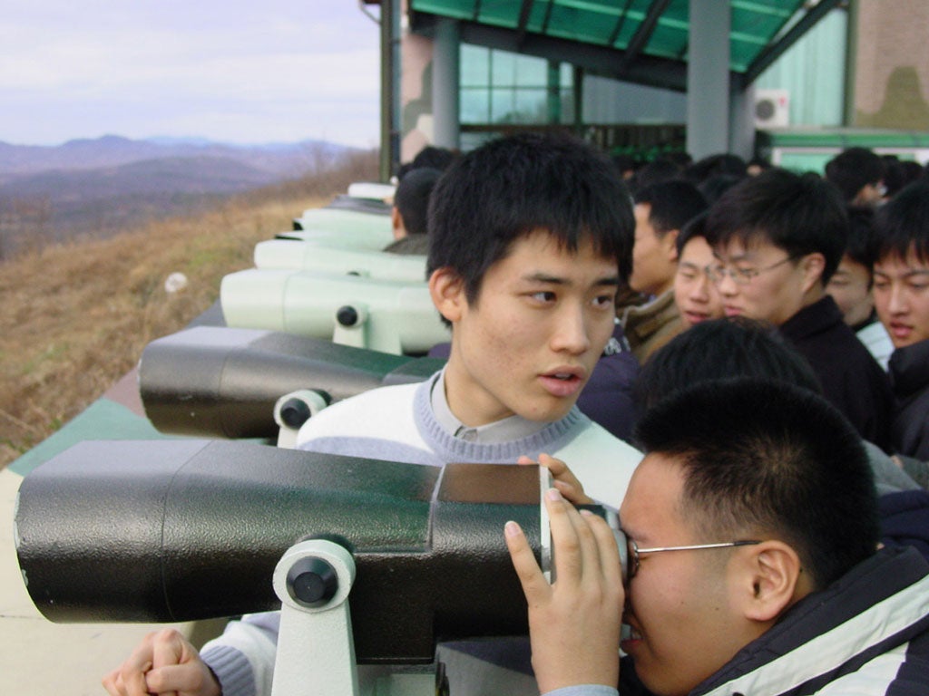 Looking ahead: Tourists on the south side of Korea's De-Militarized Zone