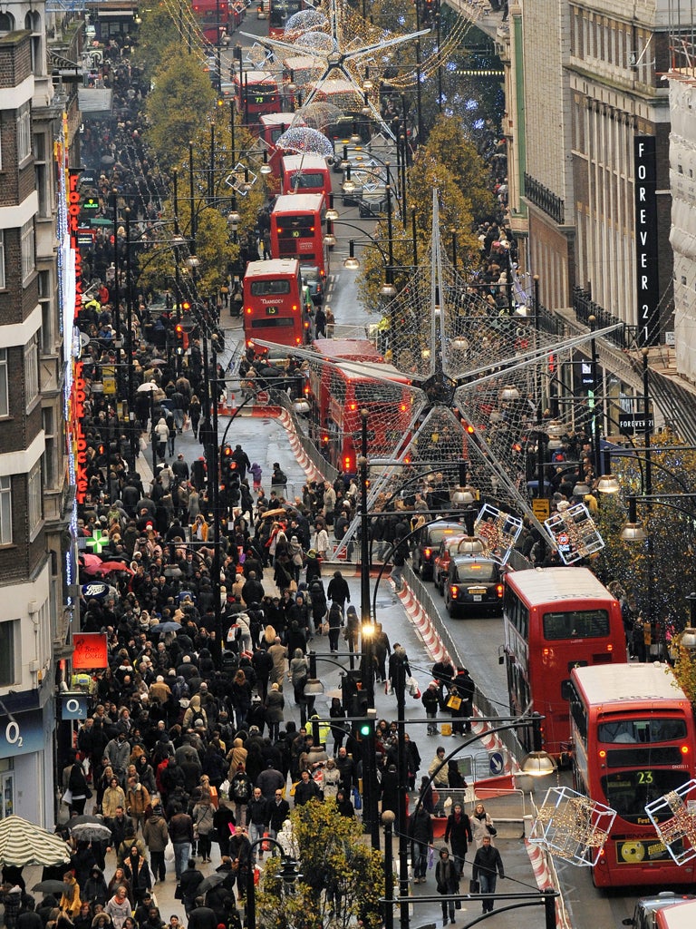 Shoppers throng Oxford Street in London yesterday
